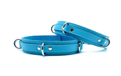 Front View: Front view of Vienna Baby Blue Italian leather thigh cuffs, showcasing the smooth leather texture and vibrant pastel blue shade against a white backdrop.