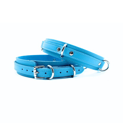 Blue Italian leather thigh cuffs with silver hardware, adjustable cuffs with smooth finish and D-ring detail